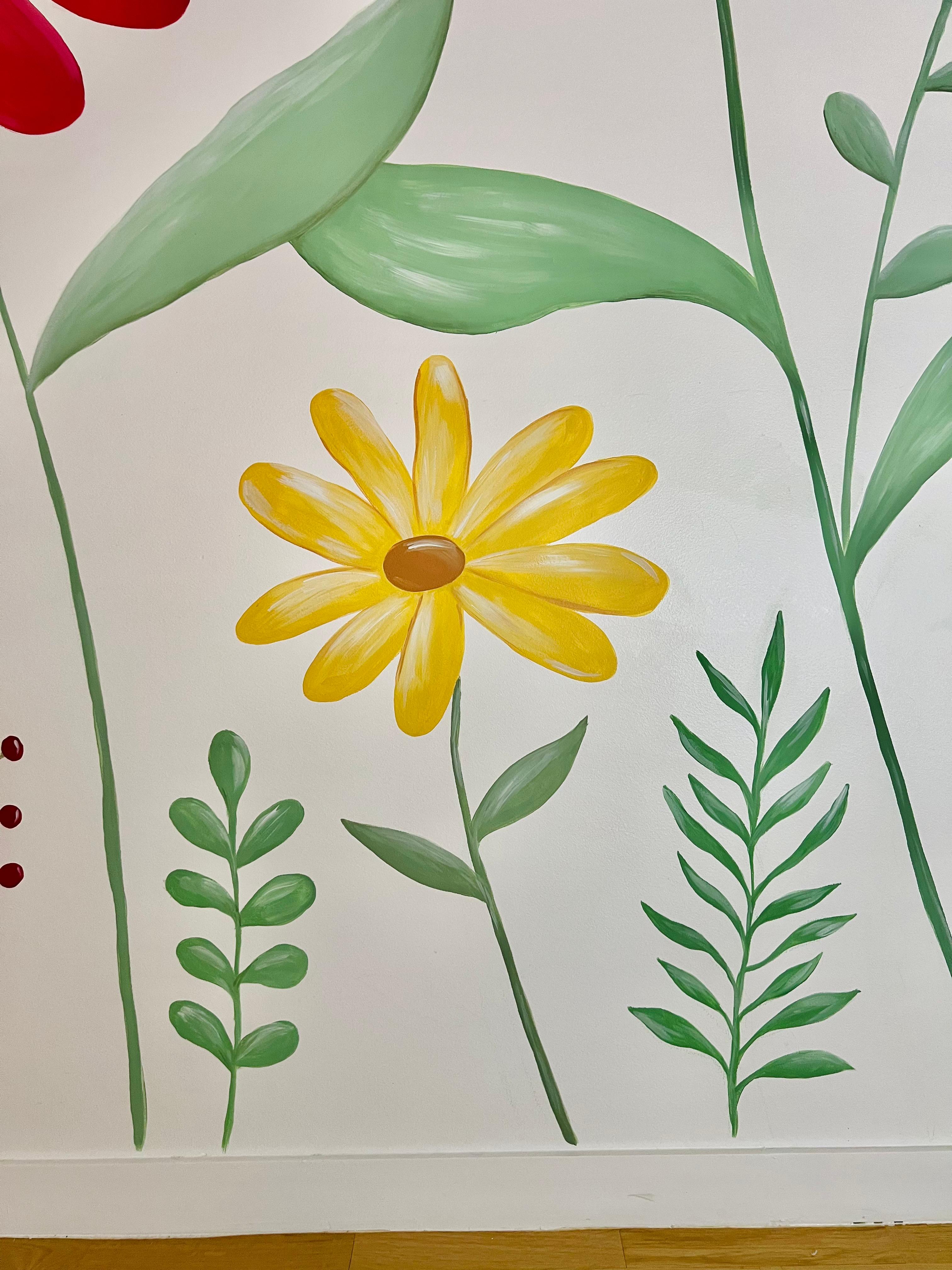 Detail of a yellow flower and leaves in the floral mural