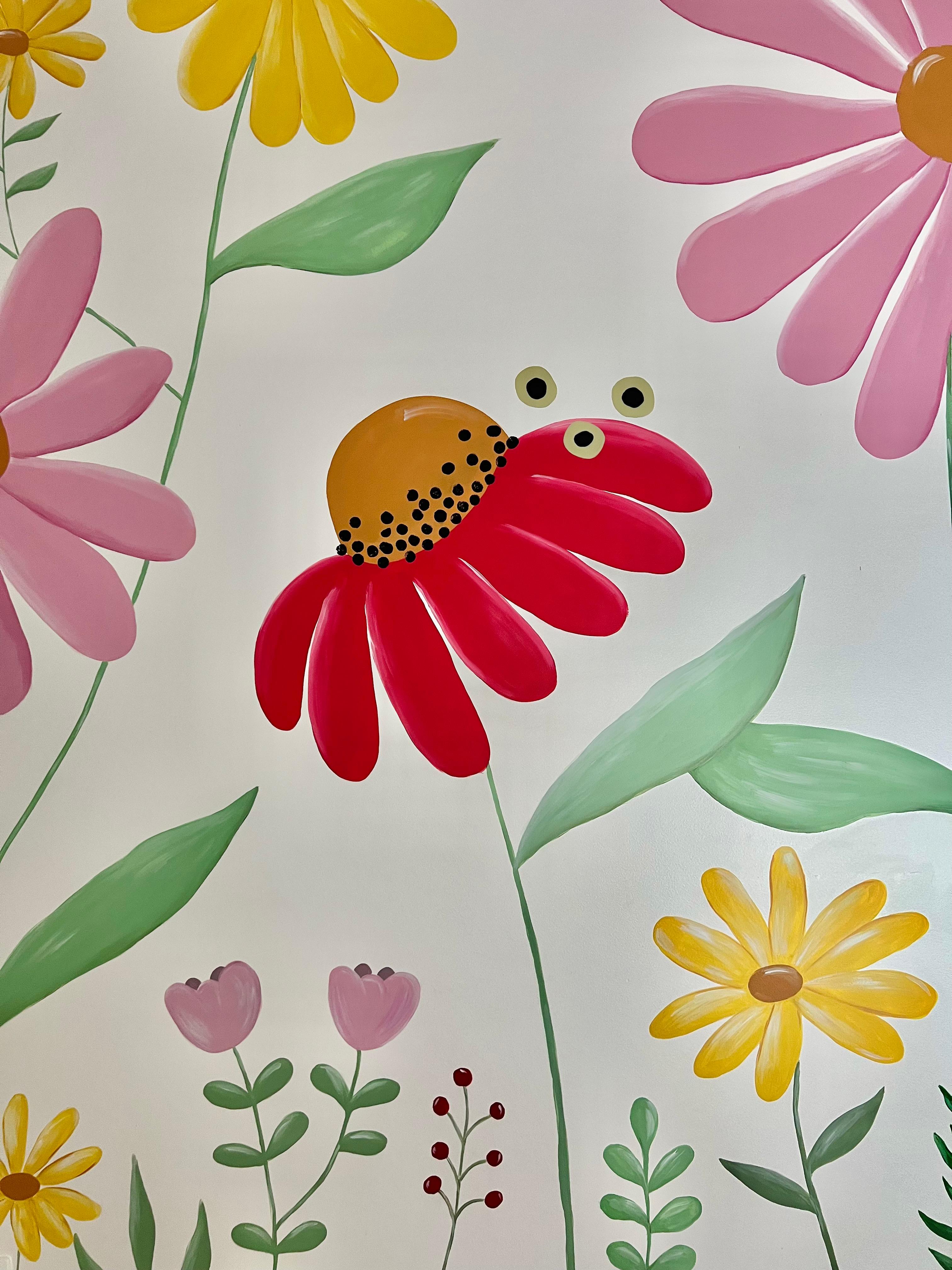 Detail of a red flower and pink flowers in the floral mural