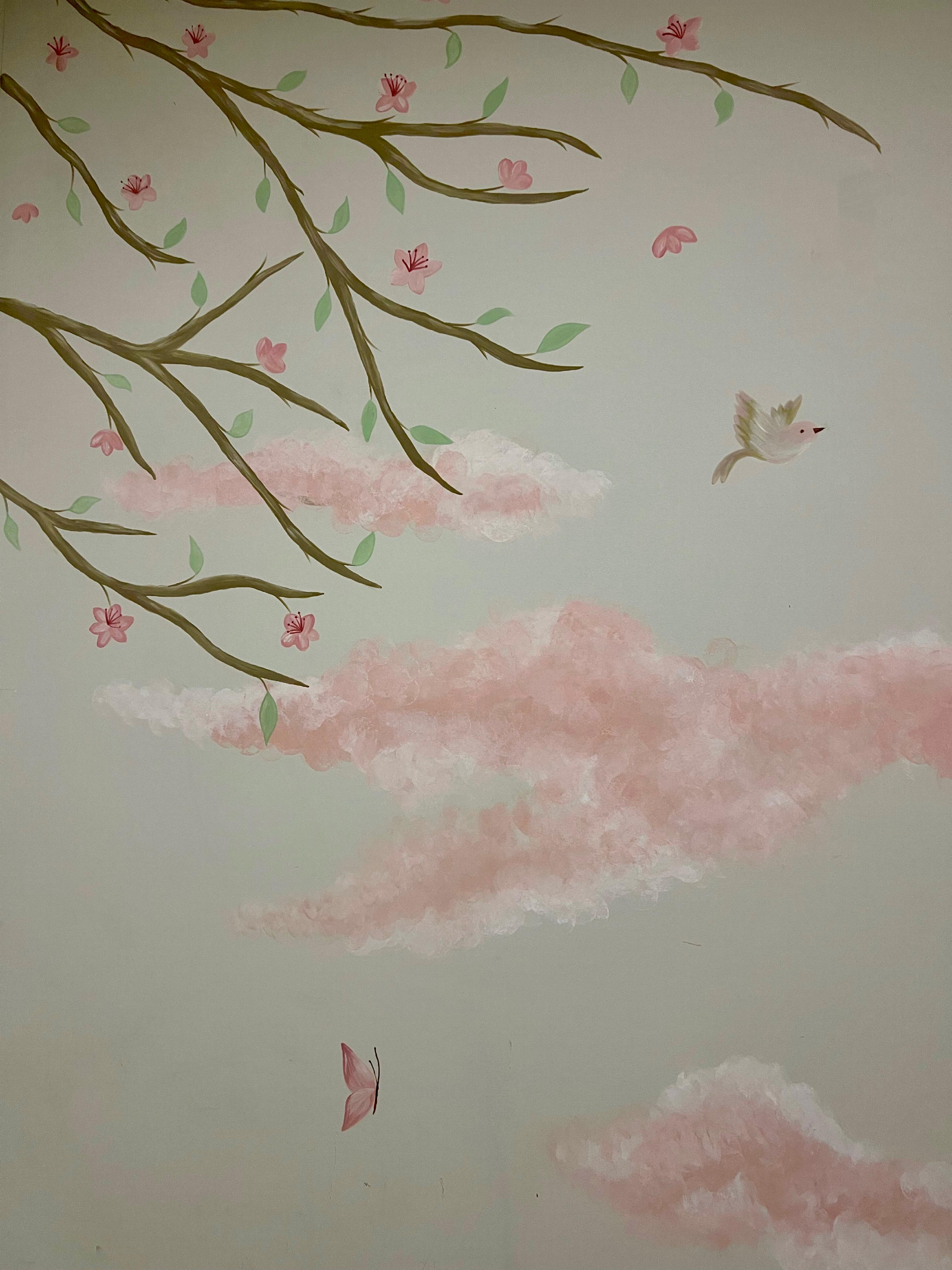 Detail of flowering branches, a bird and pink clouds