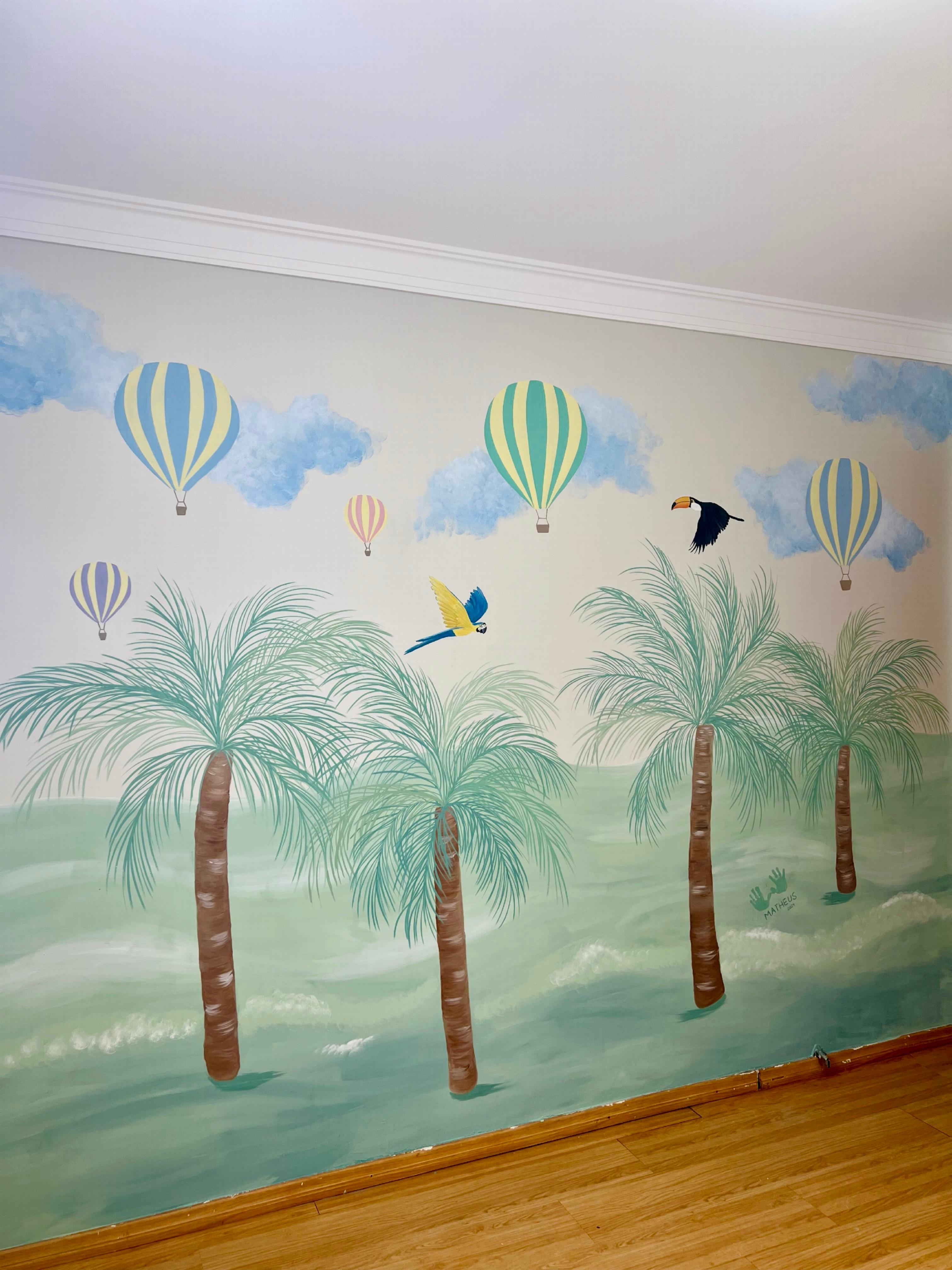 Full view of the mural featuring palm trees, macaws, a toucan and colourful hot-air balloons