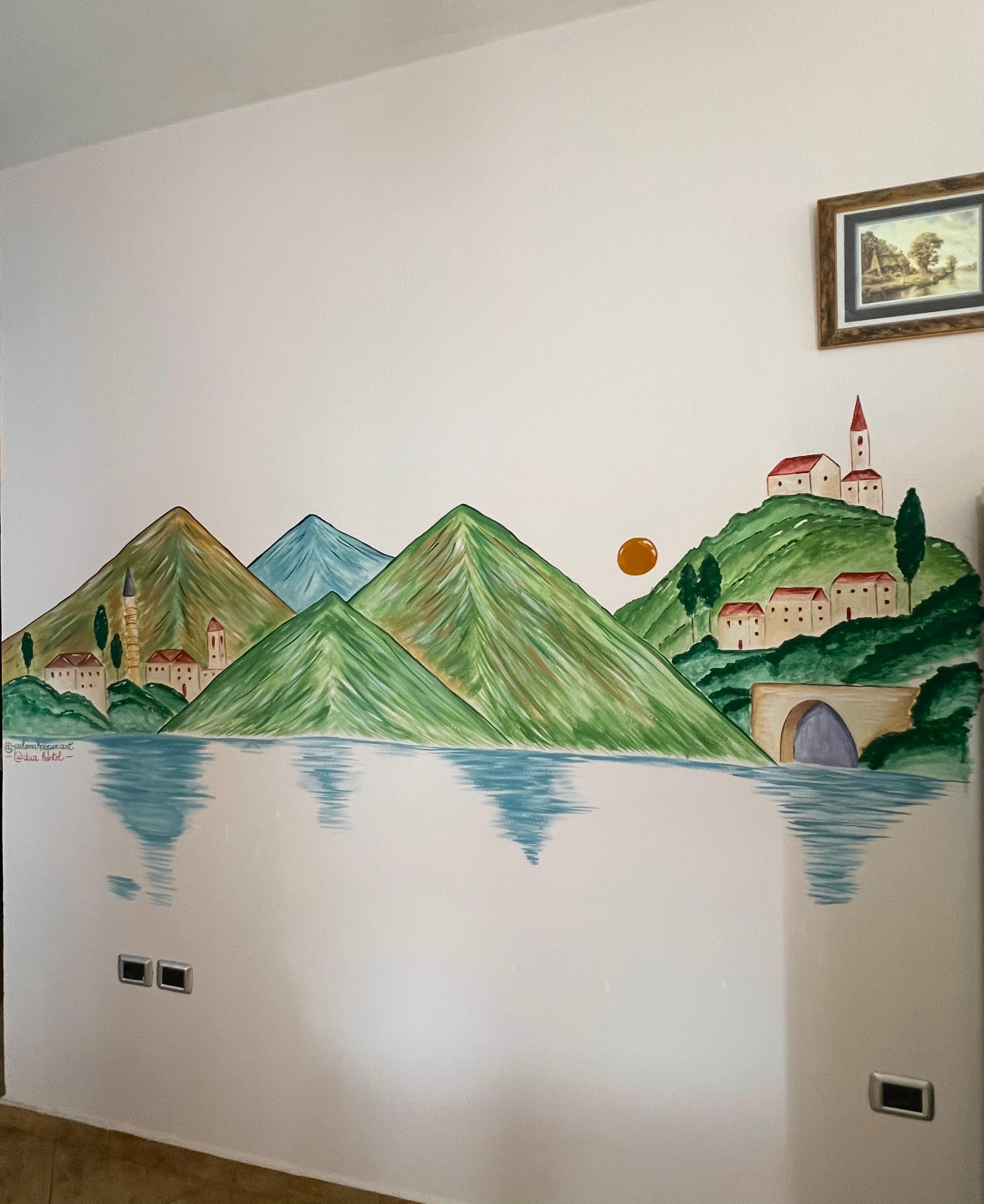 View of the mountains-and-lake mural without anyone in the frame